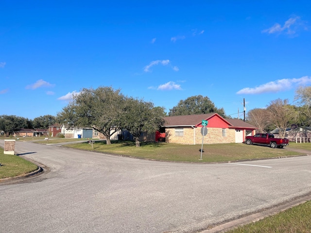 view of road featuring curbs and a residential view