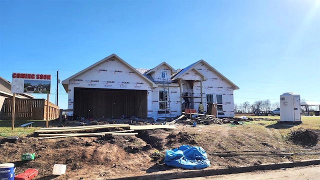 unfinished property with a garage