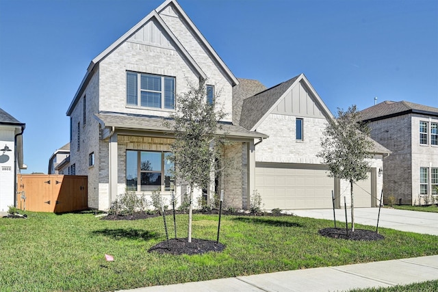 view of front facade featuring a garage and a front lawn