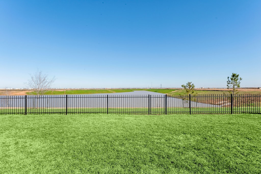 view of yard with a rural view