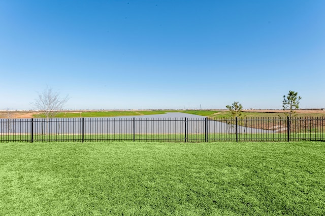 view of yard with a rural view