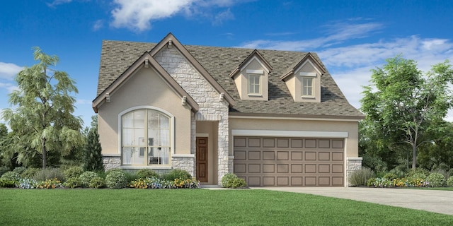 view of front of home with a front yard and a garage