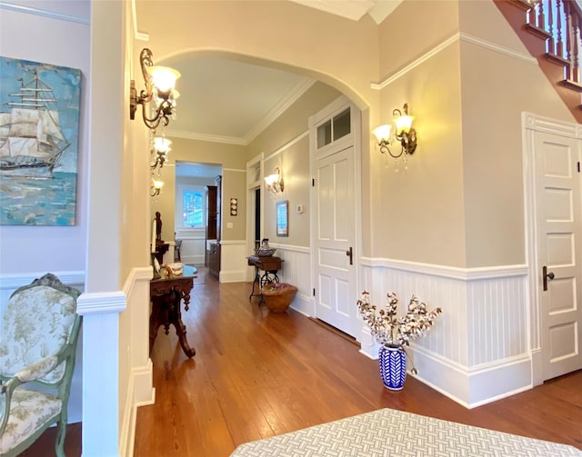 hall featuring crown molding and hardwood / wood-style flooring