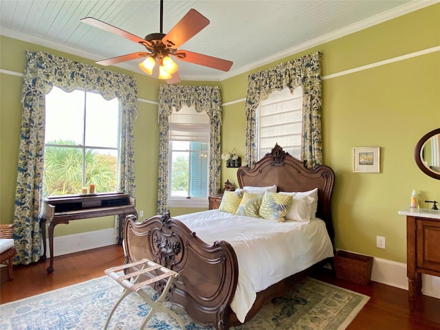 bedroom featuring ceiling fan, dark hardwood / wood-style floors, and ornamental molding