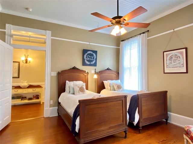 bedroom featuring hardwood / wood-style floors, ceiling fan, and crown molding