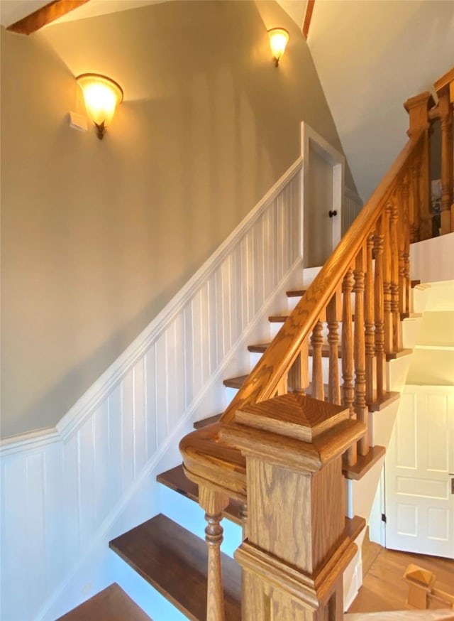 stairway with vaulted ceiling