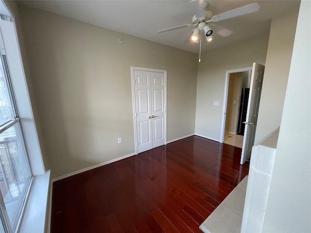 empty room featuring ceiling fan and hardwood / wood-style floors