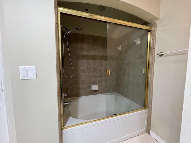 bathroom with tile patterned floors and enclosed tub / shower combo