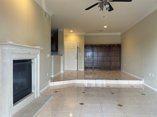 unfurnished living room with light tile patterned floors, ceiling fan, and ornamental molding