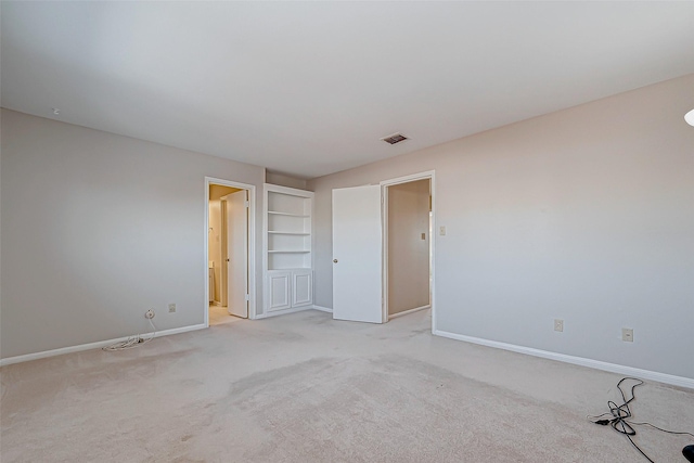 unfurnished bedroom with light colored carpet