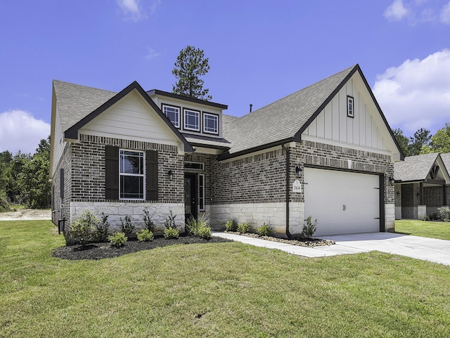 view of front of property with a front yard and a garage