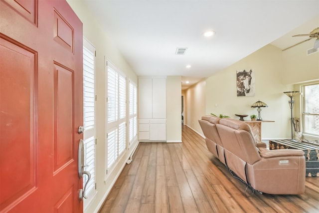 entryway with light wood-type flooring and ceiling fan