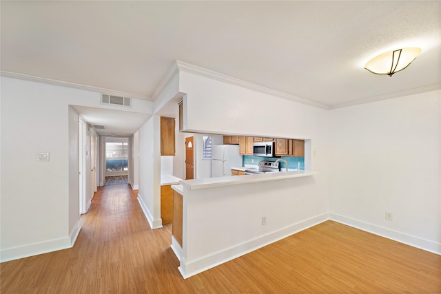 interior space featuring light hardwood / wood-style floors and ornamental molding