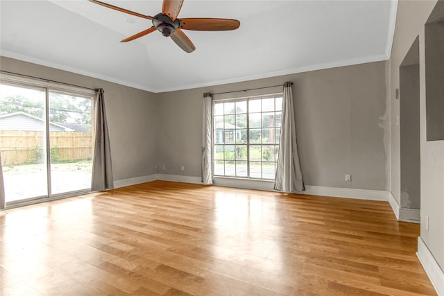 spare room with ceiling fan, crown molding, and light hardwood / wood-style floors