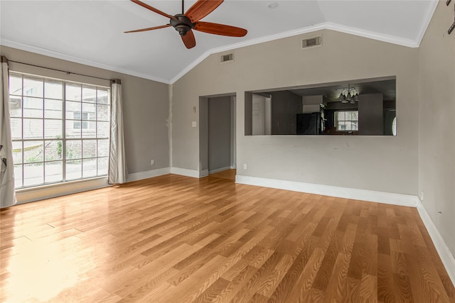 unfurnished room featuring ceiling fan with notable chandelier, light wood-type flooring, vaulted ceiling, and ornamental molding