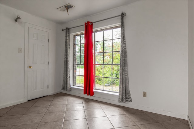 entryway featuring tile patterned floors and plenty of natural light