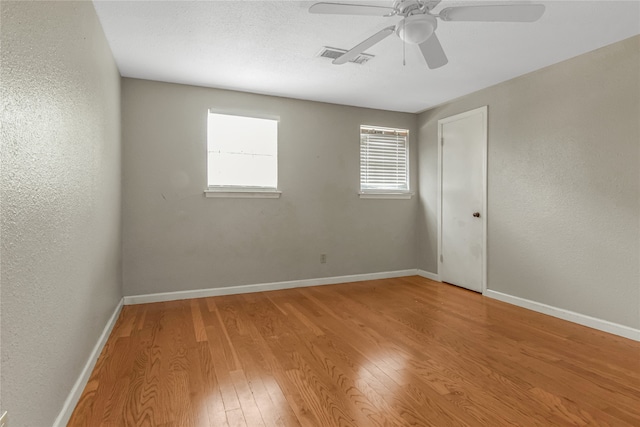 spare room featuring ceiling fan and wood-type flooring