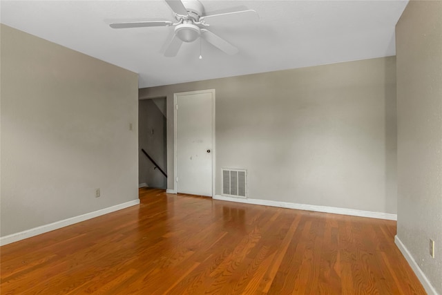 unfurnished room with ceiling fan and hardwood / wood-style floors