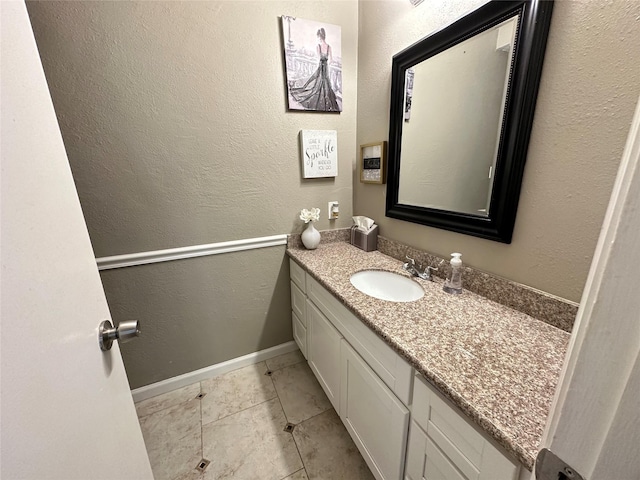 bathroom with tile patterned flooring and vanity