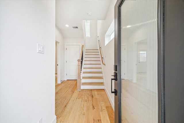 staircase featuring hardwood / wood-style floors