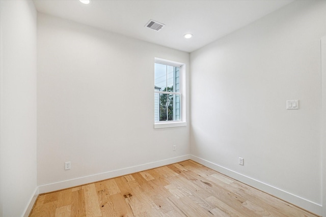 unfurnished room with light hardwood / wood-style floors