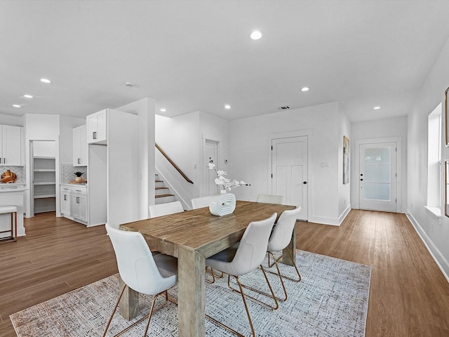 dining space with light wood-type flooring