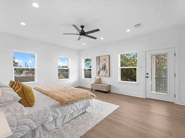 bedroom with ceiling fan, access to exterior, and light wood-type flooring