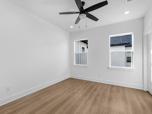 empty room with light hardwood / wood-style floors and ceiling fan