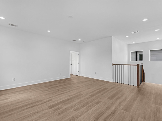 spare room with light wood-type flooring