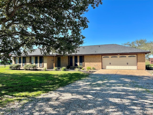 ranch-style home with a front yard and a garage