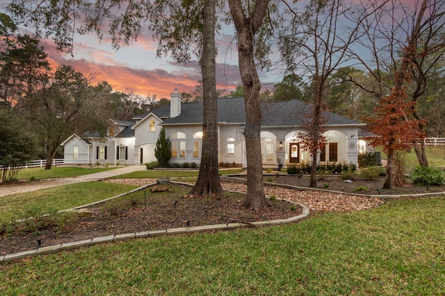 view of front of house with a lawn