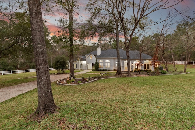 view of front of house with a lawn