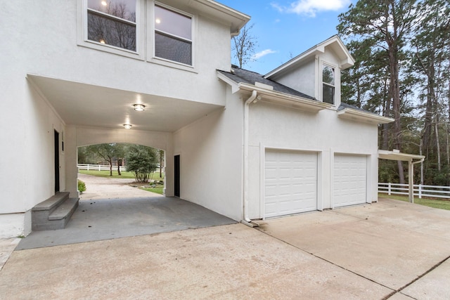 view of side of property featuring a garage