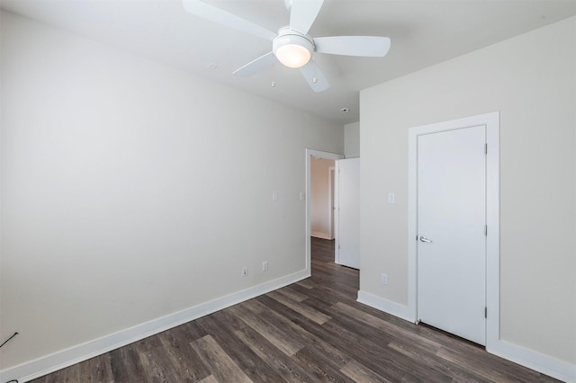 unfurnished bedroom with ceiling fan and dark hardwood / wood-style floors