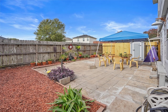 view of patio / terrace featuring a storage unit