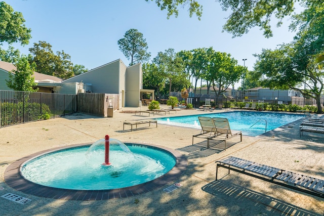 view of swimming pool with a patio area