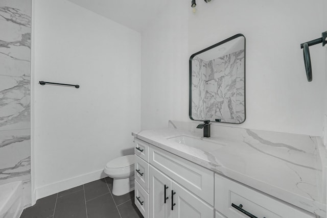 bathroom featuring toilet, vanity, and tile patterned floors