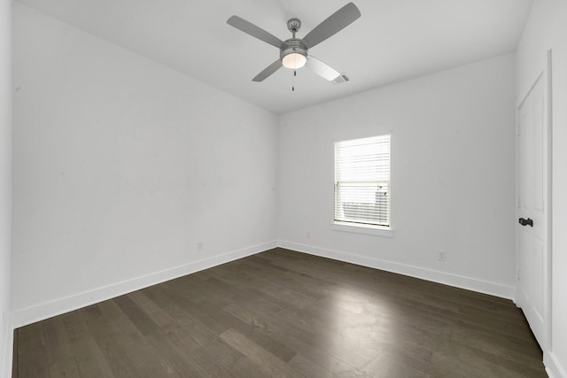 empty room featuring ceiling fan and dark hardwood / wood-style floors