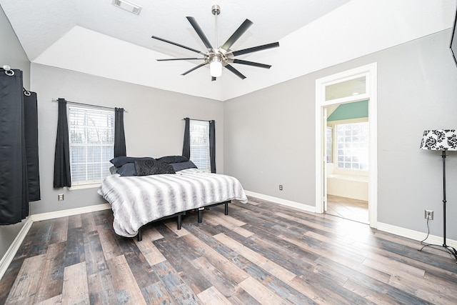 bedroom featuring connected bathroom, ceiling fan, and wood-type flooring