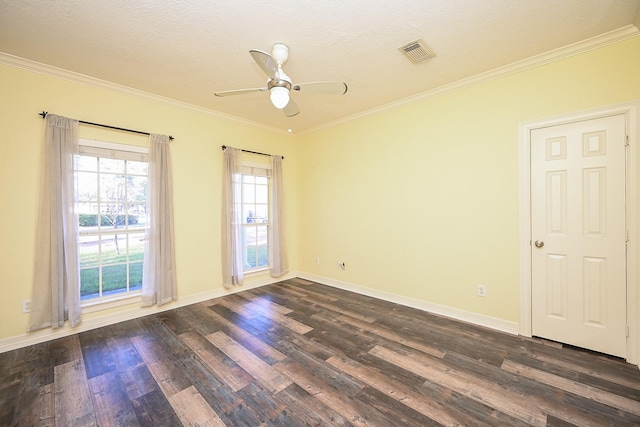 empty room featuring a textured ceiling, dark hardwood / wood-style floors, ceiling fan, and crown molding