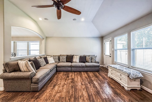 living room featuring a wealth of natural light, dark hardwood / wood-style floors, and vaulted ceiling