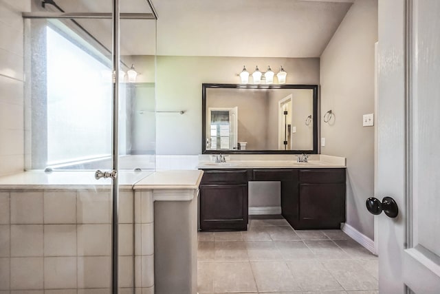 bathroom with tile patterned floors and vanity