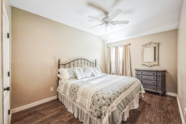 bedroom featuring dark hardwood / wood-style floors, ceiling fan, and lofted ceiling