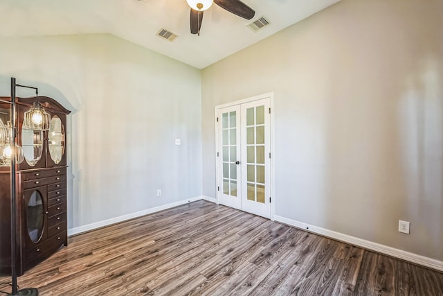 spare room featuring french doors, vaulted ceiling, ceiling fan, and hardwood / wood-style floors