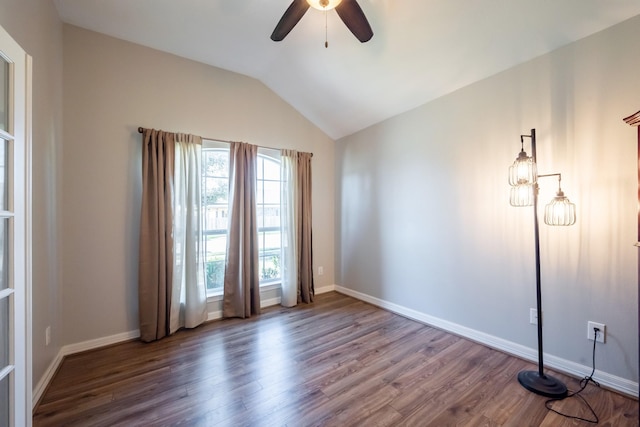 spare room featuring ceiling fan, wood-type flooring, and vaulted ceiling