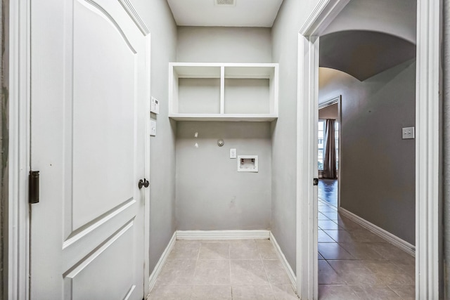 laundry area with washer hookup, hookup for a gas dryer, and light tile patterned floors