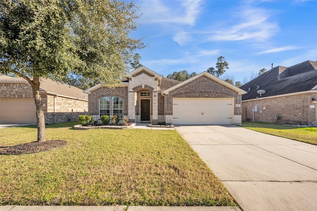 view of front of home featuring a garage and a front lawn