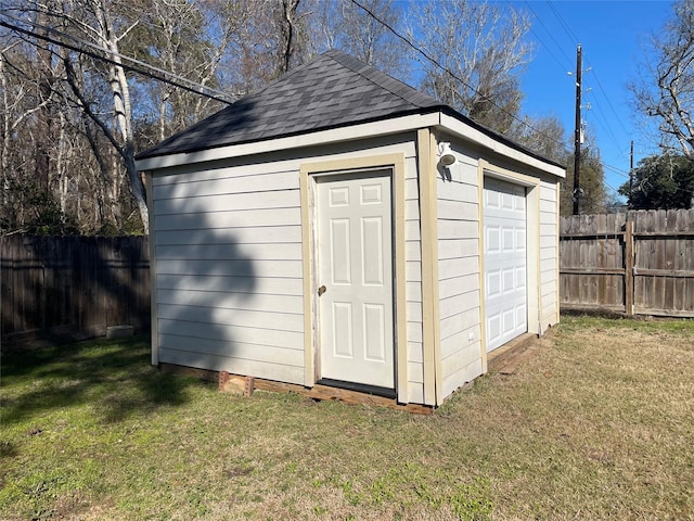 view of outbuilding with a lawn