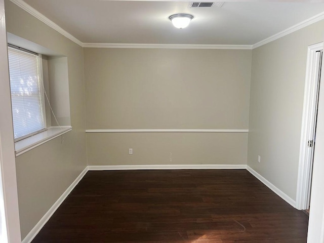 spare room with crown molding, plenty of natural light, and dark hardwood / wood-style floors