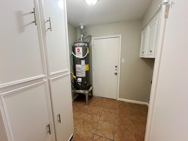 utility room featuring water heater